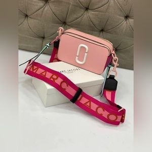 Pink/multi colored Marc Jacob purses.